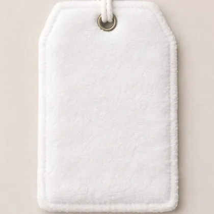 Blank white fleece TagTales tag with brass grommet and cord
